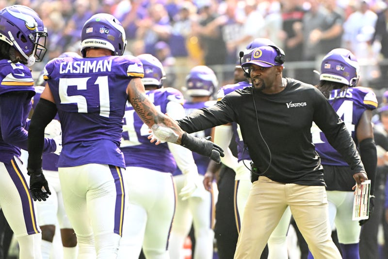 Defensive coordinator Brian Flores of the Minnesota Vikings celebrates another ferocious defensive effort which has been an early hallmark of the team.