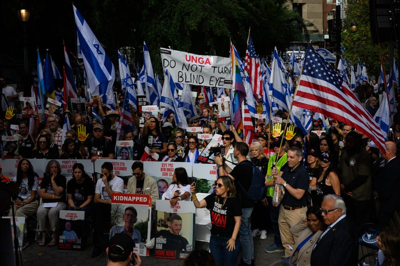 A large 'UNGA Do not turn a blind eye' sign is displayed at a rally calling on the United Nations to do more to release the hostages outside the United Nations Headquarters ahead of the General Assembly on September 20, 2024 in New York City. Rally speakers included the released hostage Aviva Segal as well as families of the hostages and New York Attorney General Letitia James.