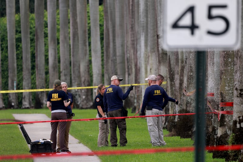 Law enforcement personnel continue to investigate on Sept. 17, 2024, in the area where the Secret Service discovered a man with a gun at the Trump International Golf Club in West Palm Beach