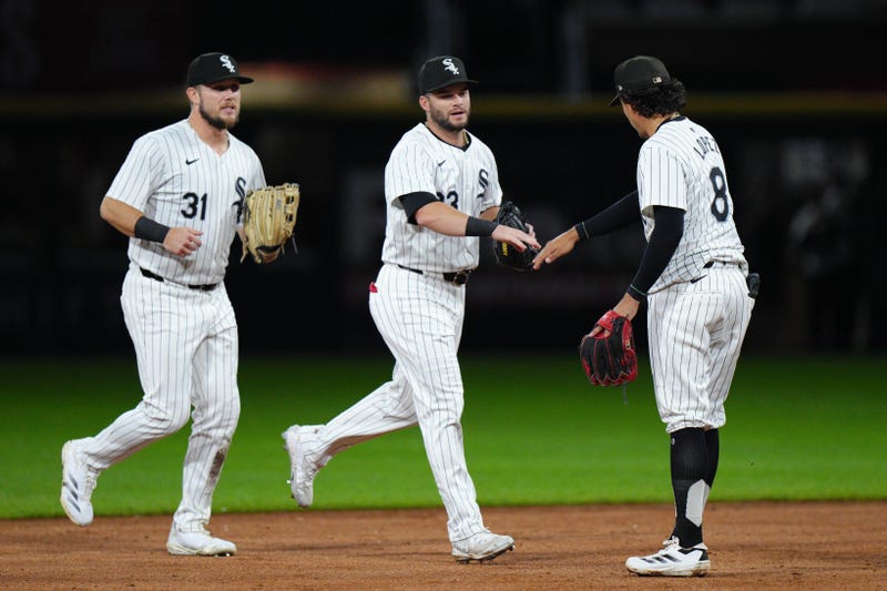 Zach DeLoach, Andrew Benintendi and Nicky Lopez celebrate
