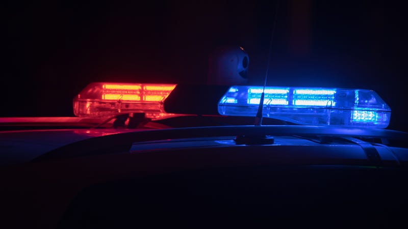 Police car lights at night in city - stock photo