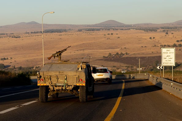 Israeli army vehicles move through the north on September 26, 2024 in Northern Israel, Israel.