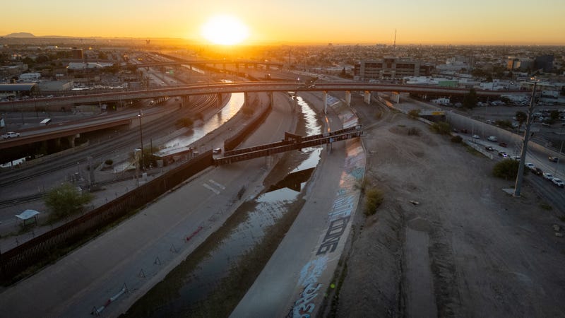 From an aerial view the Rio Grande (R) and a canal flow along the U.S.-Mexico border on Sept. 18, 2024, in El Paso, Texas.
