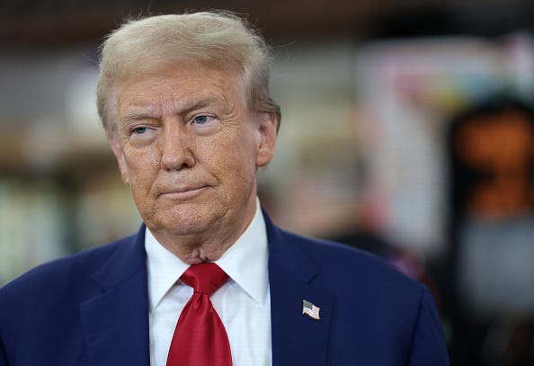 Republican presidential nominee, former U.S. President Donald Trump, looks on as he visits Sprankle's Neighborhood Market on September 23, 2024 in Kittanning, Pennsylvania. 