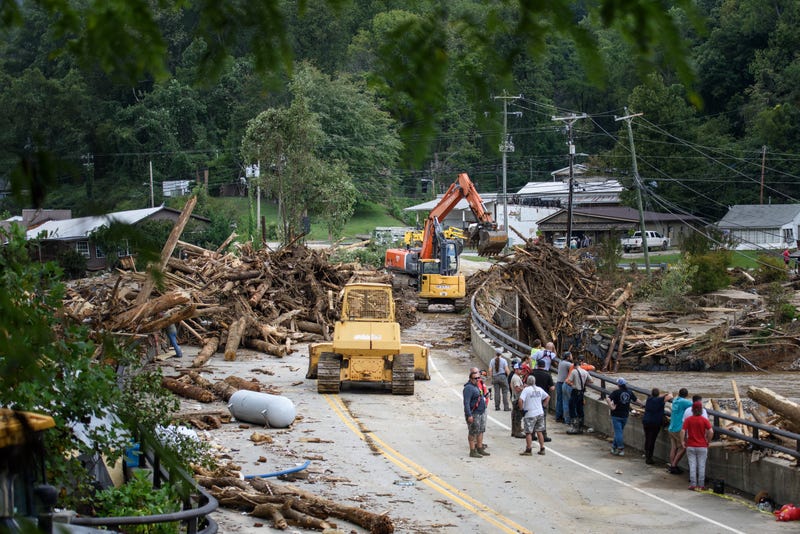 Heavy machinery clears a North Carolina road