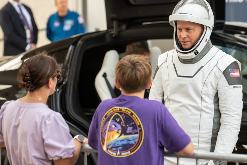 Nick Hague talks with his family minutes before heading to launch pad 40 at the Cape Canaveral Space Force Station. (