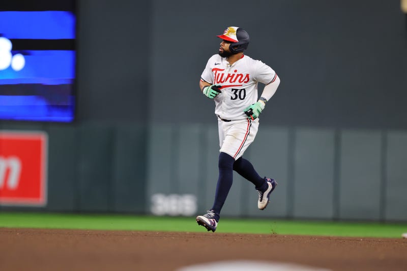 Carlos Santana #30 of the Minnesota Twins rounds the bases at Target Field. Santana signed a free agent contract to return to the Twins' AL Central rivals in Cleveland.