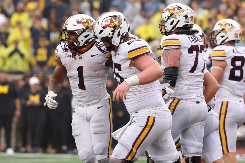 Darius Taylor #1 of the Minnesota Golden Gophers celebrates his second half touchdown with teammates while playing the Michigan Wolverines at Michigan Stadium on September 28, 2024 in Ann Arbor, Michigan.