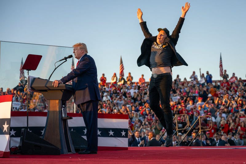 Tesla CEO Elon Musk leaps for joy on stage as he joins former Republican presidential candidate Donald Trump during a campaign rally at the site of an assassination attempt in Butler, Pennsylvania, on Oct. 5.