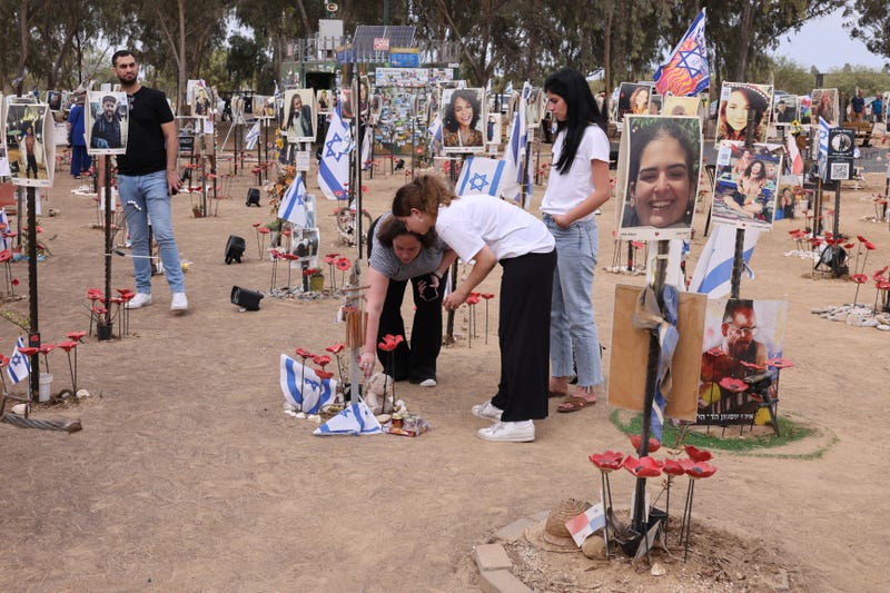 People visit an installation honoring those who were killed and kidnapped in the Supernova music festival during the October 7 attacks by Palestinian militants, at the site of the festival near Kibbutz Reim in southern Israel on October 6, 2024