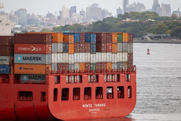 A container ship sits anchored in New York Harbor