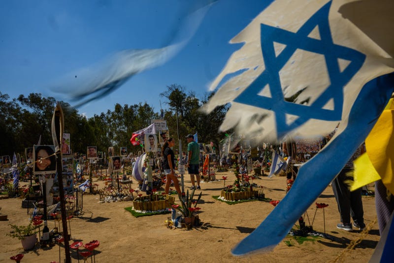 People visit the Nova festival memorial site on October 04, 2024 in Re'im, Israel. Over the last few months the grounds around Re'im Park have been turned into a memorial for the victims, and hostages from the Nova music festival which was attacked by Hamas on the morning of October 7th.