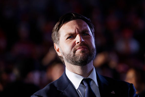 Republican vice presidential candidate Sen. JD Vance listens as Republican presidential nominee, former President Donald Trump speaks at a campaign rally at the Butler Farm Show fairgrounds on October 05, 2024 in Butler, Pennsylvania. 