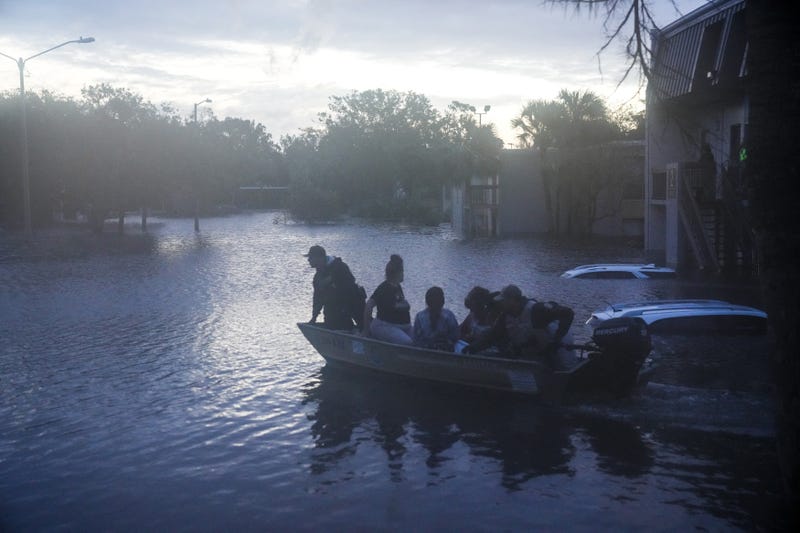 Residents are rescued from an apartment complex in Clearwater that was flooded from and overflowing creek due to Hurricane Milton on October 10, 2024 in Florida