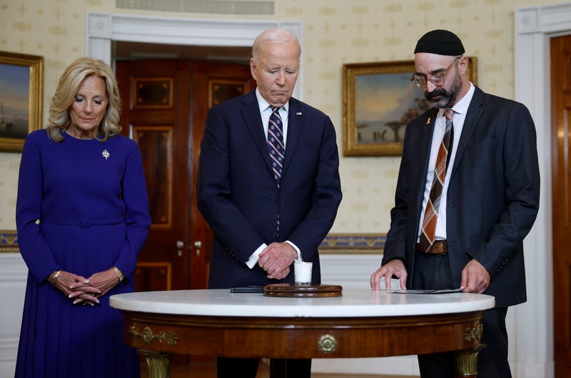 U.S. President Joe Biden participates in a moment of silence at a remembrance ceremony on the one-year anniversary of the Hamas attack on Israel in the Blue Room at the White House on October 7, 2024 in Washington