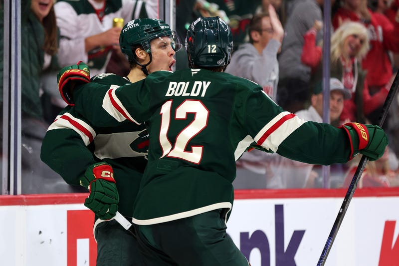 Joel Eriksson Ek #14 of the Minnesota Wild celebrates his goal against the Columbus Blue Jackets with teammate Matt Boldy #12 in the second period of the season opener at Xcel Energy Center on October 10, 2024 in St Paul, Minnesota. 
