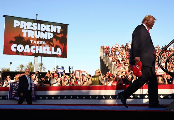 Republican presidential nominee, former U.S. President Donald Trump walks onstage for a campaign rally on October 12, 2024 in Coachella, California. 