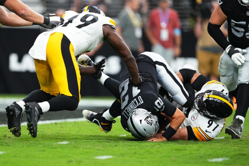 Cameron Heyward #97 of the Pittsburgh Steelers sacks Aidan O'Connell #12 of the Las Vegas Raiders in the fourth quarter of a game at Allegiant Stadium on October 13, 2024 in Las Vegas, Nevada.