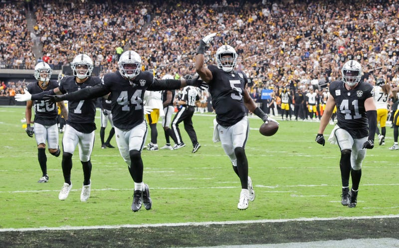 Isaiah Pola-Mao #20, Tre'von Moehrig #7, K'Lavon Chaisson #44, Divine Deablo #5 and Robert Spillane #41 of the Las Vegas Raiders celebrate an interception by Deablo against the Pittsburgh Steelers in the second quarter of their game at Allegiant Stadium on October 13, 2024 in Las Vegas, Nevada.