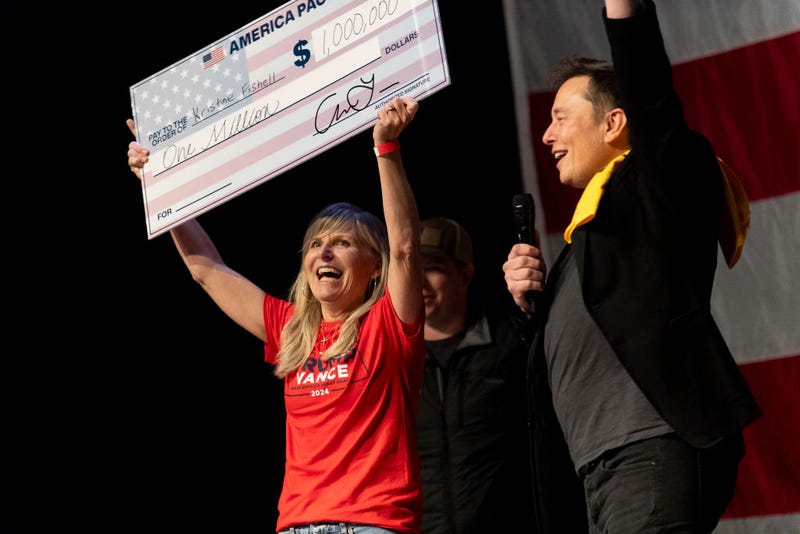 SpaceX and Tesla founder Elon Musk awarded Kristine Fishell with a "$1 million check" during a town hall at the Roxain Theater in Pittsburgh, on Oct. 20.