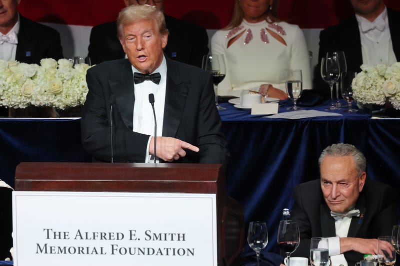 Former President Donald Trump points to Senate Majority Leader Chuck Schumer as he speaks during the annual Alfred E. Smith Foundation Dinner at the New York Hilton Midtown on October 17, 2024