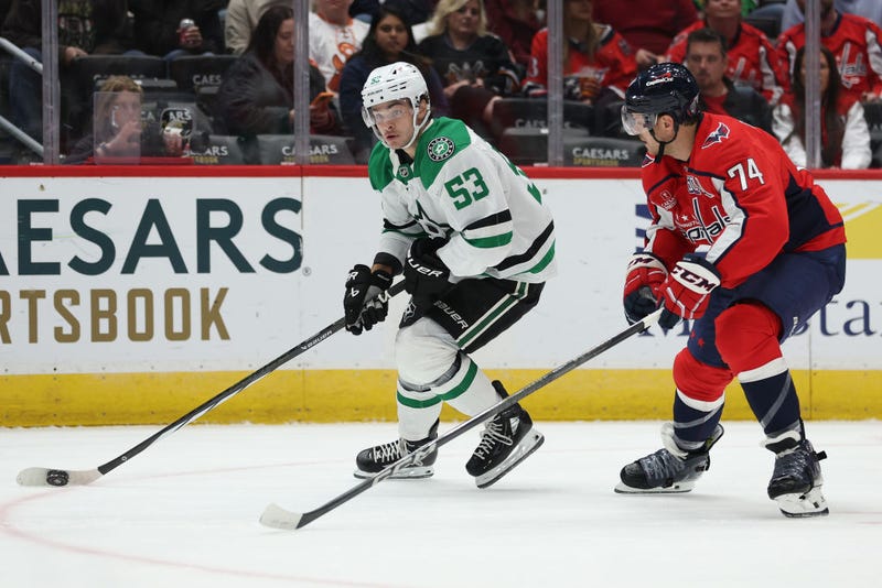 WASHINGTON, DC - OCTOBER 17: Wyatt Johnston #53 of the Dallas Stars skates past John Carlson #74 of the Washington Capitals during the first period at Capital One Arena on October 17, 2024 in Washington, DC. 