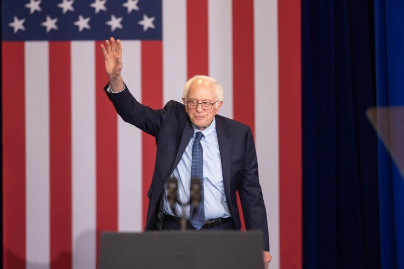 CONCORD, NEW HAMPSHIRE - OCTOBER 22: U.S. Sen. Bernie Sanders (I-VT) waves as he walks on stage at NHTI Concord Community College on October 22, 2024 in Concord, New Hampshire. The visit was to highlight the Biden-Harris administration's goal of lowering the cost of prescription drugs.