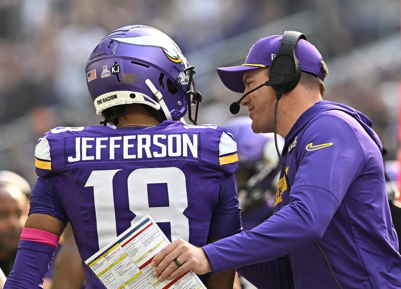 Head coach Kevin O'Connell of the Minnesota Vikings talks with Justin Jefferson #18 in the in the first quarter of a game against the Detroit Lions at U.S. Bank Stadium on October 20, 2024 in Minneapolis, Minnesota.