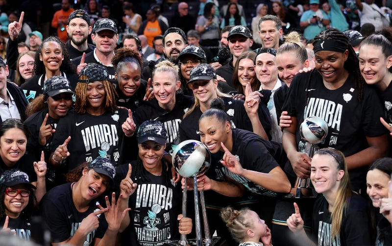 The New York Liberty pose after their win over the Minnesota Lynx in Game 5 of the WNBA Finals at Barclays Center on Oct. 20, 2024