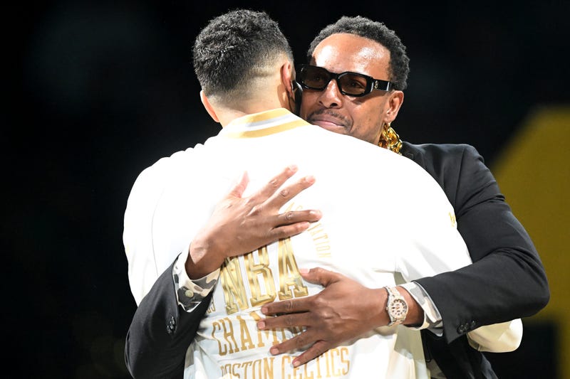 Former Boston Celtics, Paul Pierce, and Jayson Tatum #0 of the Boston Celtics embrace during the NBA Championship ring ceremony prior to the game against the New York Knicks at TD Garden on October 22, 2024 in Boston, Massachusetts