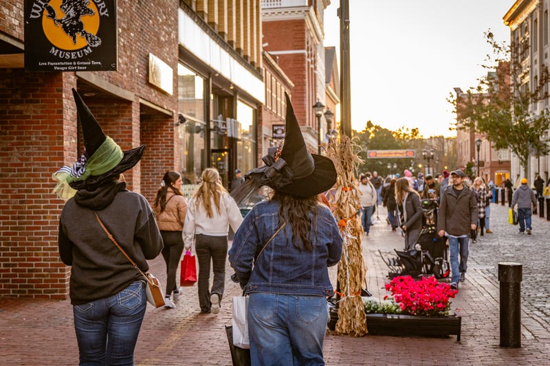 Stock image of people wearing witch hats