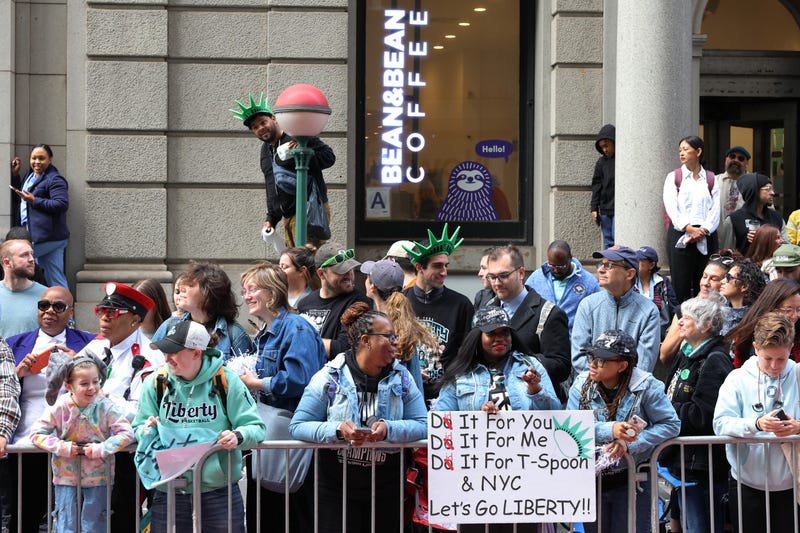 New York Liberty fans wait for the start of their WNBA championship parade on Broadway on October 24, 2024 in New York City