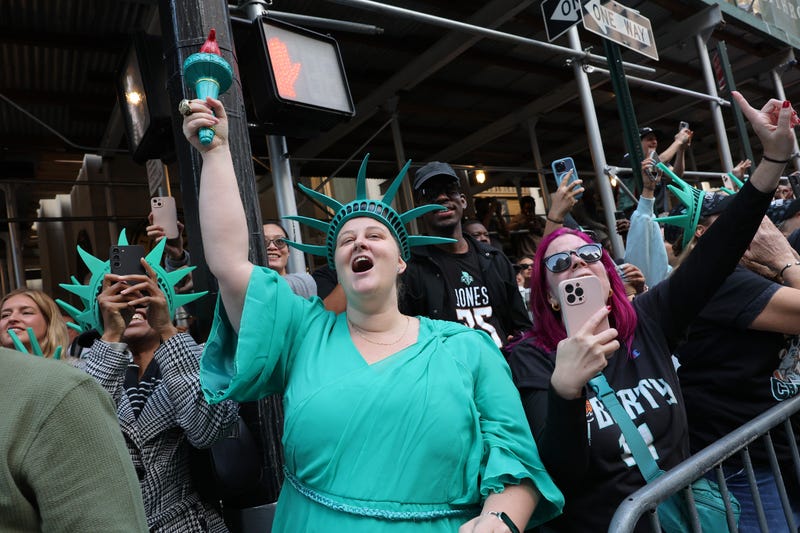 New York Liberty fans celebrate their WNBA championship during their parade on Broadway on October 24, 2024