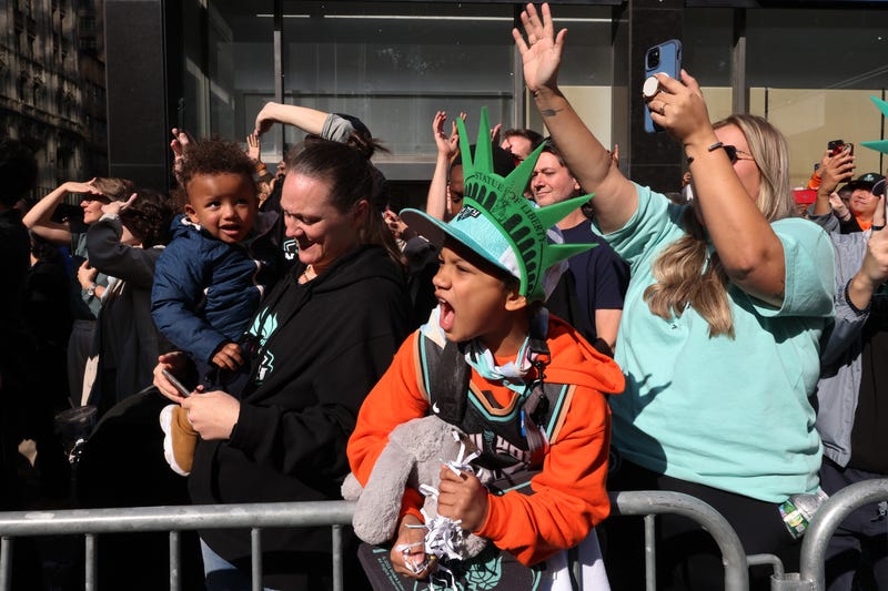 New York Liberty fans celebrate their WNBA championship during their parade on Broadway on October 24, 2024.