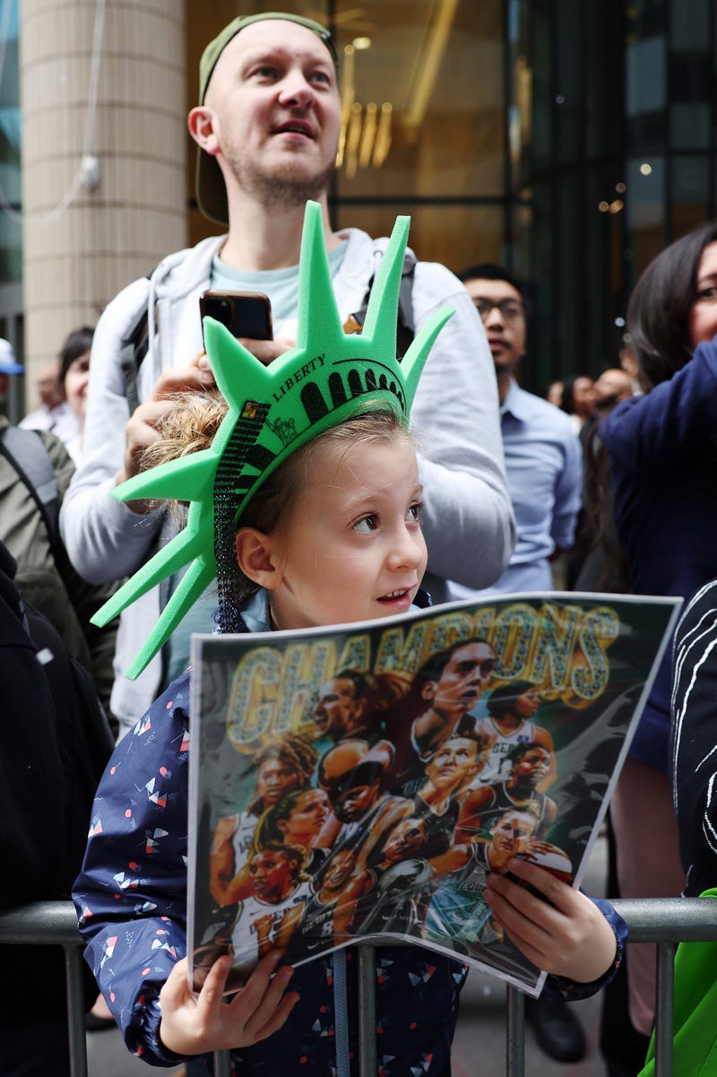 Fans cheer during the New York Liberty Ticker Tape Victory Parade & Rally on October 24, 2024