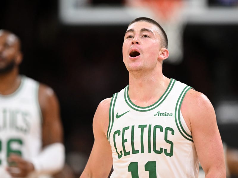  Payton Pritchard #11 of the Boston Celtics reacts after making a three-point basket against the Milwaukee Bucks during the first half at the TD Garden on October 28, 2024 in Boston, Massachusetts. 