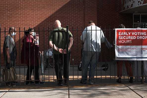 Residents wait in line to vote at an early-voting location in the Humboldt Park neighborhood, which has been a stronghold for the city's Puerto Rican community since the 1970s, on October 29, 2024 in Chicago, Illinois.