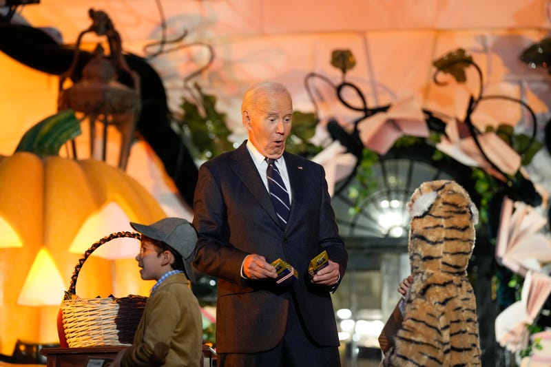 President Biden greets a trick-or-treater during a Halloween event at the White House on October 30, 2024