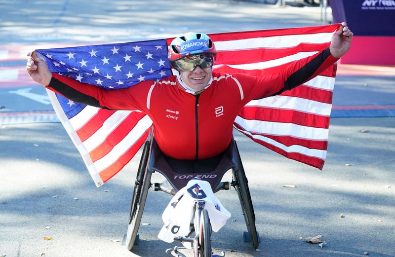 Daniel Romanchuk of the US celebrates after crossing the finish line to win the men's wheelchair division during the New York Marathon in New York City on Nov. 3, 2024. 