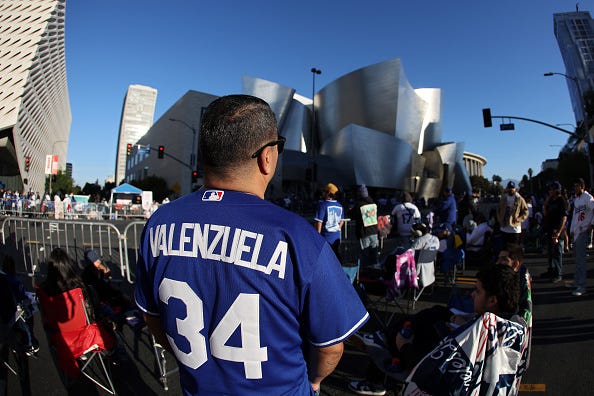 A fan wearing a Fernando Valenzuela jersey looks on during the 2024 World Series Championship parade on November 01, 2024 in Los Angeles, California.