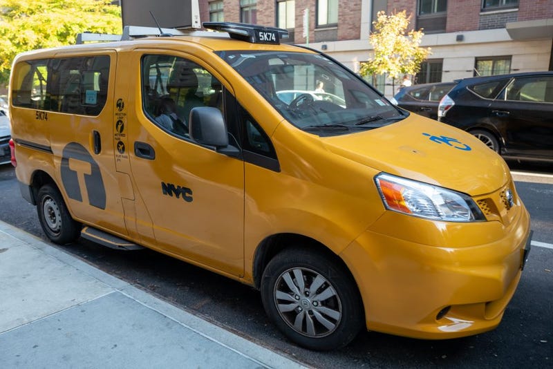 Yellow NYC taxi parked on a residential street on a sunny day, Oct. 22, 2024. 