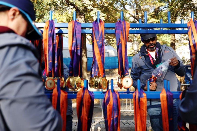 Volunteers hang medals ahead of the 2024 TCS New York City Marathon on Nov. 3, 2024 in New York City.