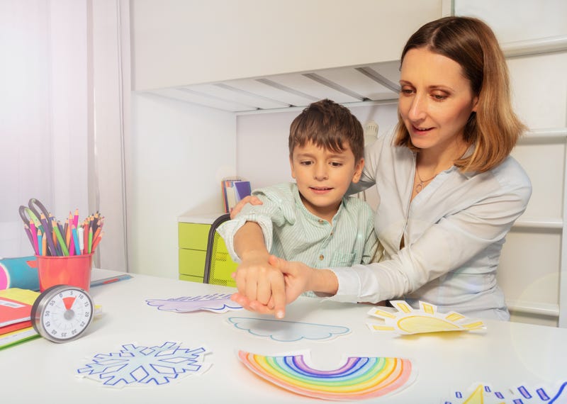 Therapist Teaching Autistic Boy