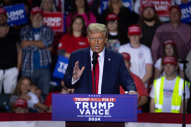 Republican presidential nominee, former U.S. President Donald Trump, speaks at a rally during the early morning hours of election day on November 5, 2024, in Grand Rapids, Michigan.