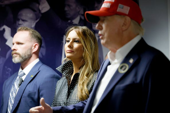 Republican presidential nominee former President Donald Trump thanks his staff at his campaign headquarters as wife Melania Trump looks on, November 05, 2024 in West Palm Beach, Florida.