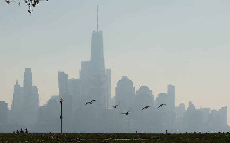 Smoke from brush fires in the New York and New Jersey region shrouds the skyline of lower Manhattan and One World Trade Center in New York City on Nov. 1, 2024, as seen from Hoboken New Jersey.