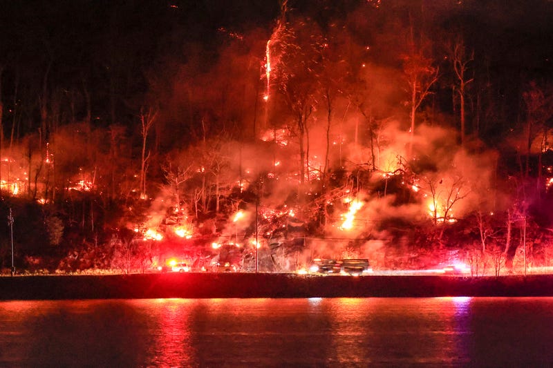 First responders arrive at an area burning by the Jennings Creek Wildfire on November 13, 2024 in Greenwood Lake, New York