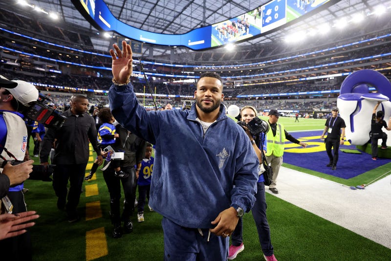 Former defensive lineman Aaron Donald waves to the crowd prior to the game between the Miami Dolphins and the Los Angeles Rams