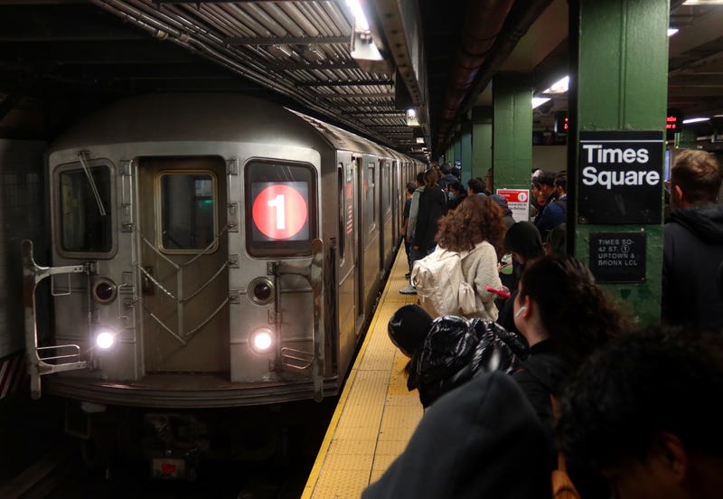 People wait to board a 1-line train at the Times Square station on November 12, 2024
