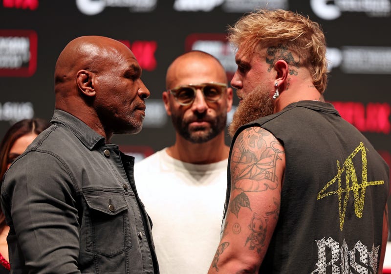 (L-R) Mike Tyson, Nakisa Bidarian, and Jake Paul attend the press conference for LIVE on Netflix: Jake Paul vs. Mike Tyson at the Toyota Music Factory on November 13, 2024 in Dallas, Texas. 